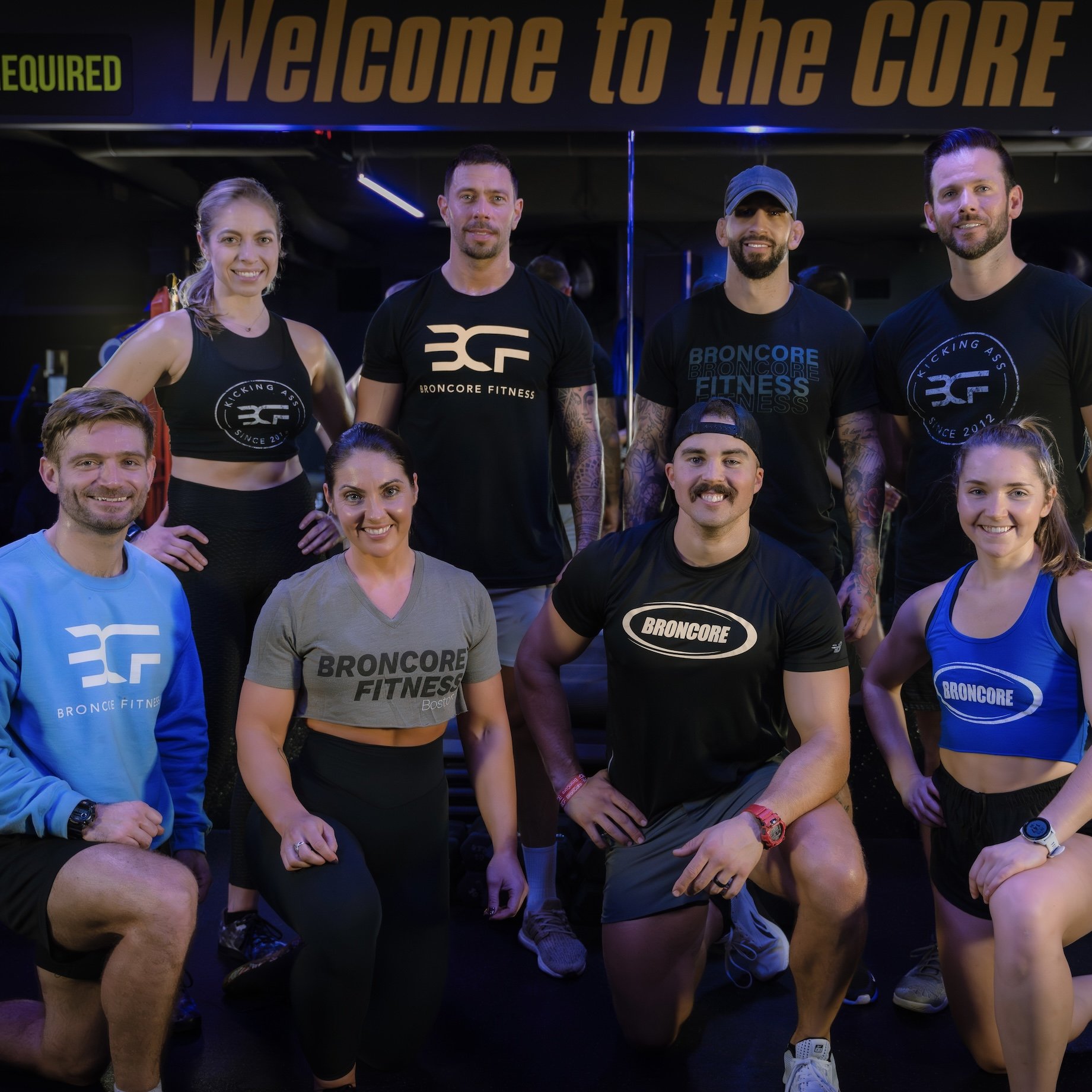 BronCore Fitness coaches and members at the studio entrance
