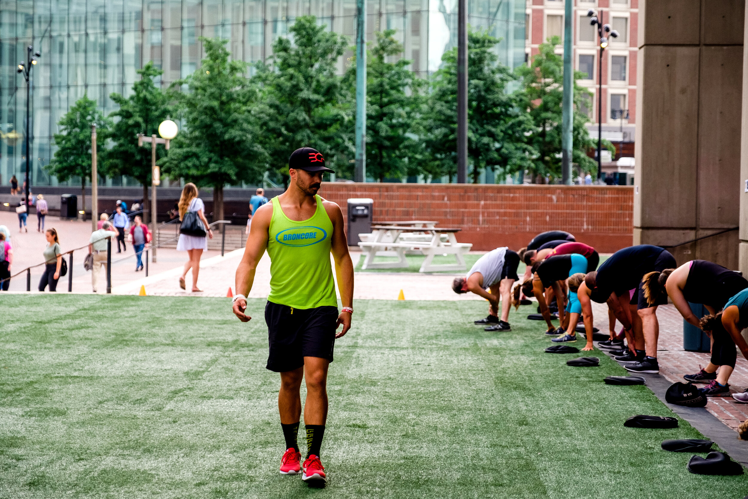 Outside BronCore Fitness in Downtown Boston — a bootcamp session on the green beside the Court St. buildings